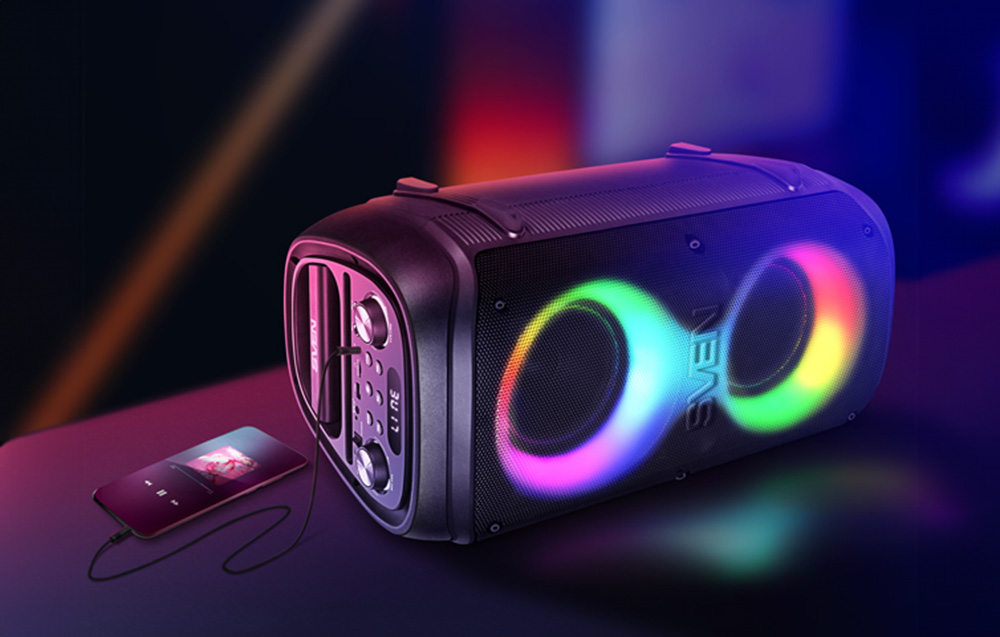 enceinte avec éclairage RGB, à côté un smartphone connecté